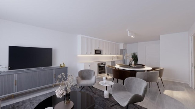 133 Salem Unit 418, Revere, MA 02151 - living room featuring light wood-type flooring and baseboards
