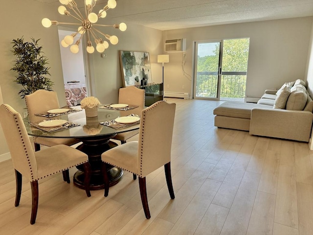 180 Green St Unit 415, Melrose, MA 02176 - dining area with a baseboard heating unit, light wood-style flooring, a wall mounted air conditioner, and a chandelier