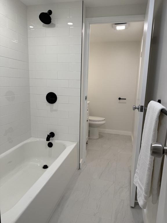 180 Green St Unit 415, Melrose, MA 02176 - full bath featuring marble finish floors and shower / washtub combination