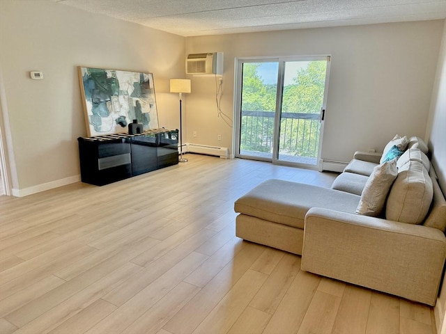 180 Green St Unit 415, Melrose, MA 02176 - living area with a baseboard heating unit, a wall mounted AC, and light wood finished floors