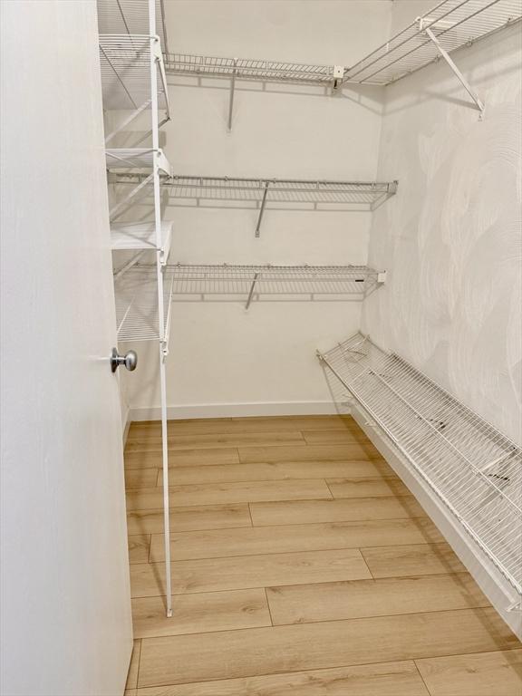 180 Green St Unit 415, Melrose, MA 02176 - spacious closet with wood finished floors