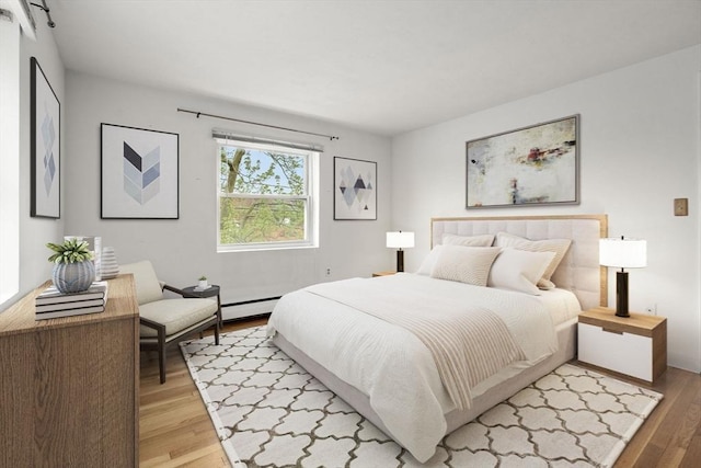 150 Main St Unit 12, Stoneham, MA 02180 - bedroom featuring light wood finished floors