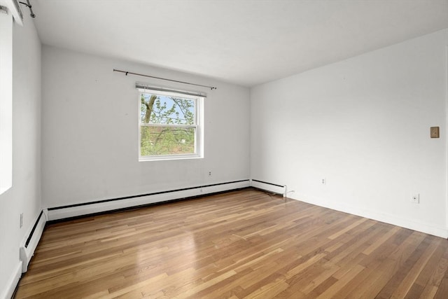 150 Main St Unit 12, Stoneham, MA 02180 - unfurnished room with wood finished floors and baseboards