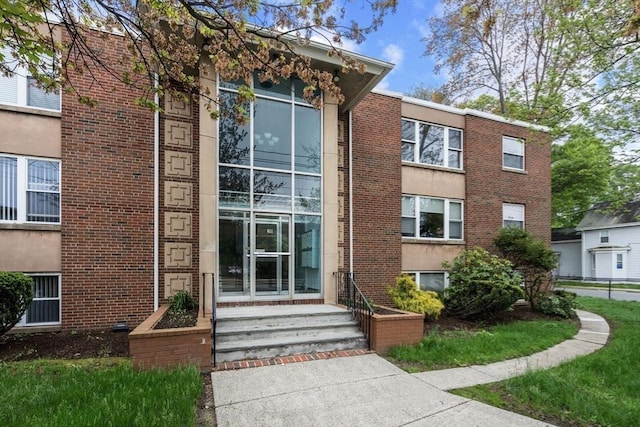 150 Main St Unit 12, Stoneham, MA 02180 - view of front facade featuring brick siding