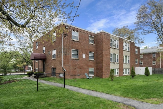 150 Main St Unit 12, Stoneham, MA 02180 - view of building exterior featuring fence