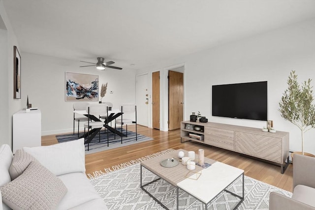 150 Main St Unit 12, Stoneham, MA 02180 - living room with a ceiling fan and wood finished floors