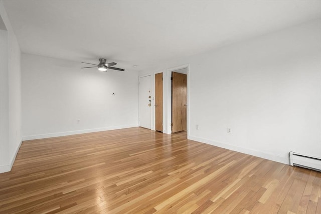 150 Main St Unit 12, Stoneham, MA 02180 - unfurnished room with a ceiling fan, light wood-style floors, and baseboards