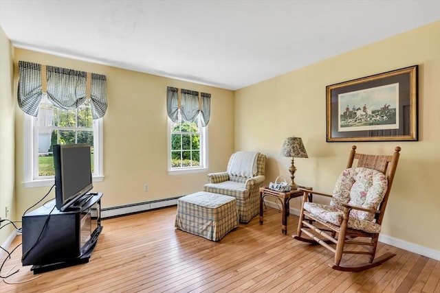 72 Rosemary Ln, Barnstable, MA 02632 - living area with light wood finished floors, a baseboard heating unit, and baseboards