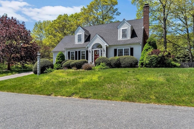 72 Rosemary Ln, Barnstable, MA 02632 - cape cod-style house featuring a chimney, a front lawn, and roof with shingles