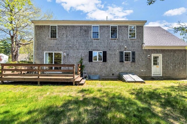 72 Rosemary Ln, Barnstable, MA 02632 - back of property featuring a wooden deck, a yard, and roof with shingles