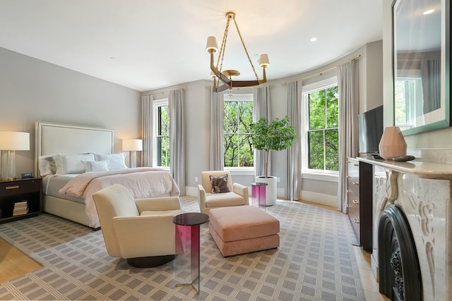 bedroom featuring an inviting chandelier