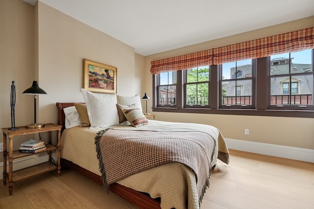 bedroom with light hardwood / wood-style flooring