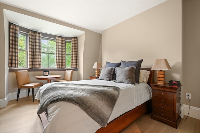 bedroom with light wood-type flooring