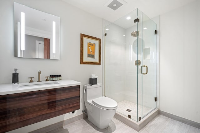 bathroom featuring walk in shower, vanity, toilet, and hardwood / wood-style flooring