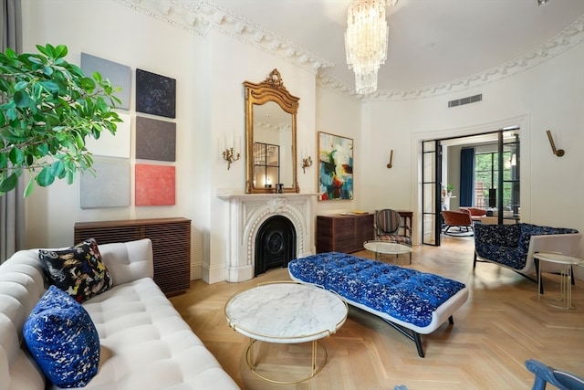 living room with a notable chandelier and light parquet floors