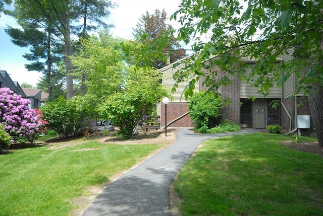 238 Brown Bear Xing Unit 238, Acton, MA 01720 - view of green lawn with driveway