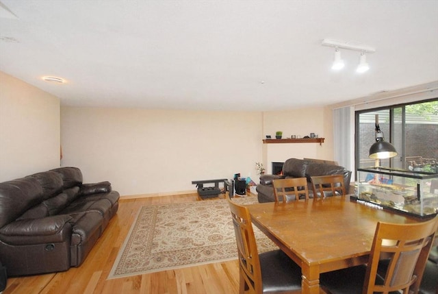 238 Brown Bear Xing Unit 238, Acton, MA 01720 - dining space with wood finished floors and rail lighting