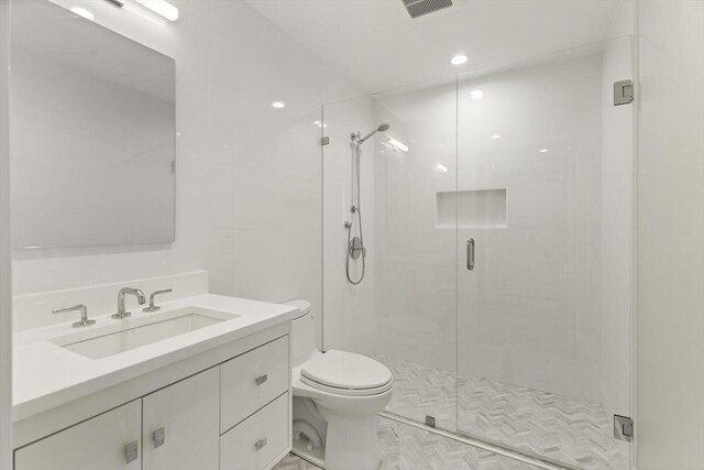 234 Causeway St Apt 709, Boston, MA 02114 - bathroom featuring vanity, a stall shower, toilet, and visible vents