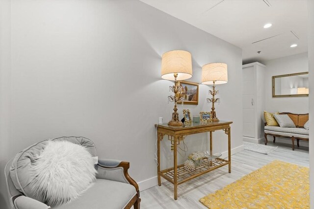 234 Causeway St Apt 709, Boston, MA 02114 - living area with baseboards, attic access, light wood finished floors, and recessed lighting