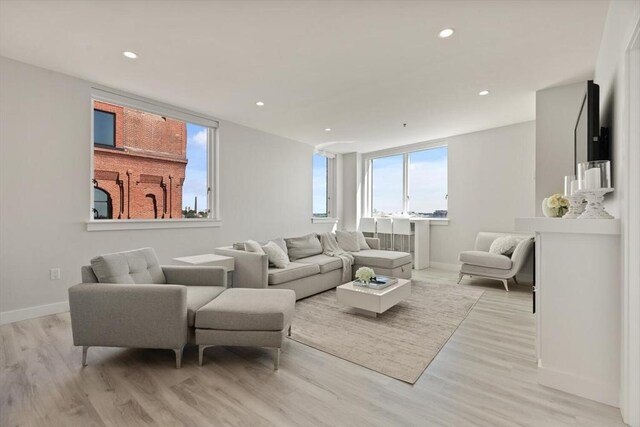 234 Causeway St Apt 709, Boston, MA 02114 - living room featuring recessed lighting, baseboards, and light wood finished floors