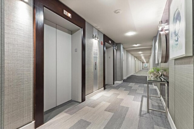 234 Causeway St Apt 709, Boston, MA 02114 - corridor featuring elevator and baseboards