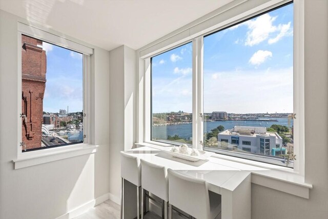 234 Causeway St Apt 709, Boston, MA 02114 - dining area with baseboards and a water view