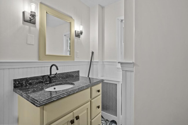 bathroom featuring wainscoting and vanity