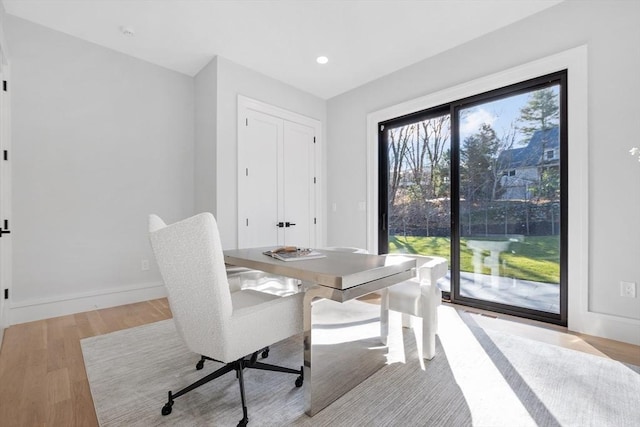 dining space with light hardwood / wood-style flooring