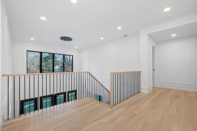 stairs with hardwood / wood-style flooring