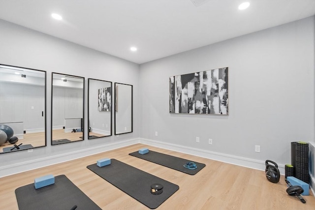 workout room with hardwood / wood-style flooring