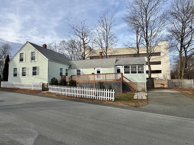 view of front of house with a wooden deck