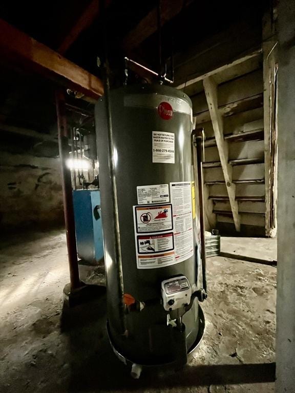 utility room featuring water heater