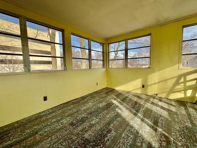 unfurnished sunroom with plenty of natural light