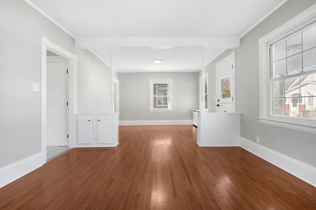 unfurnished room with ornamental molding and hardwood / wood-style floors