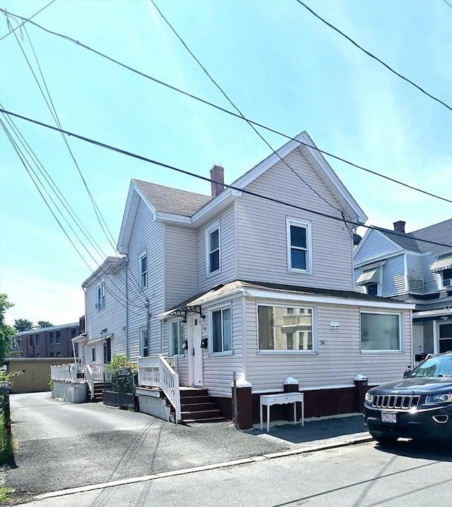16 Willoughby St, Lawrence, MA 01841 - view of front of house with a chimney