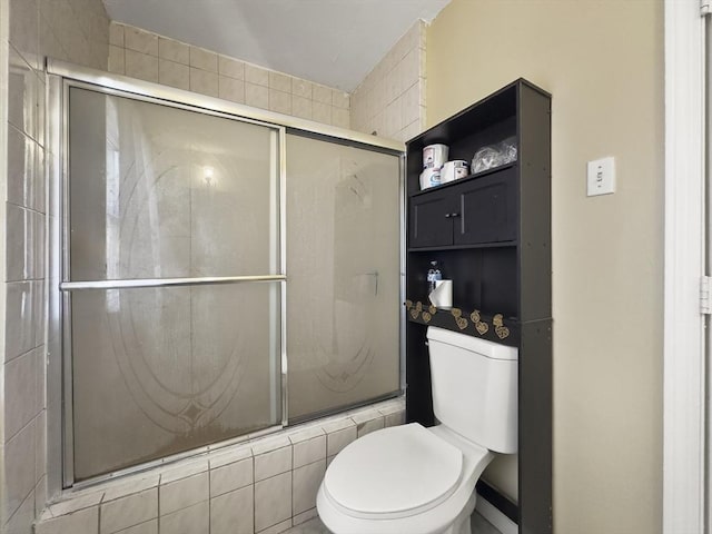 16 Willoughby St, Lawrence, MA 01841 - bathroom featuring a shower with door and toilet