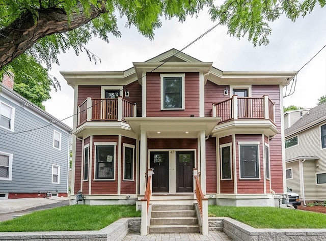 view of front of property with a balcony