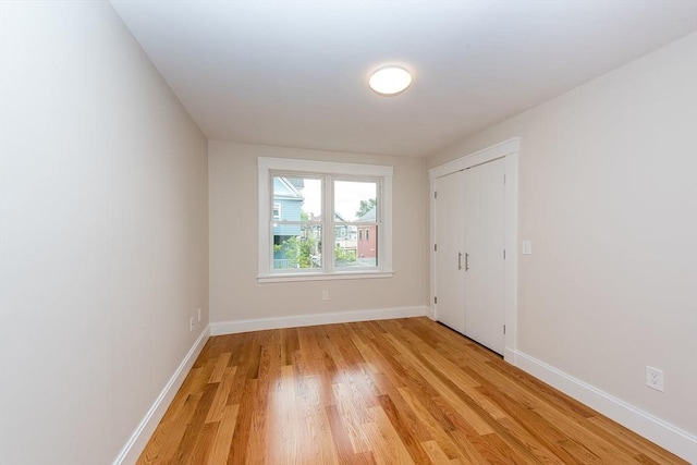 spare room featuring light hardwood / wood-style floors