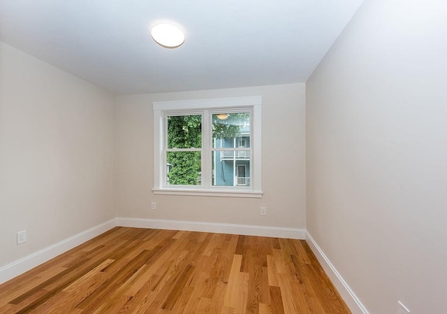 spare room featuring light hardwood / wood-style floors