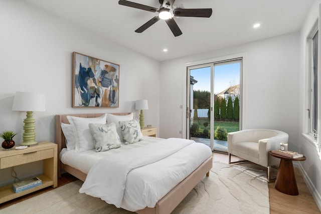 bedroom with ceiling fan, access to exterior, and light hardwood / wood-style flooring