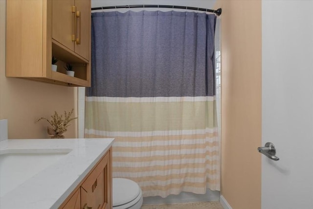 bathroom with shower / bathtub combination with curtain, vanity, and toilet