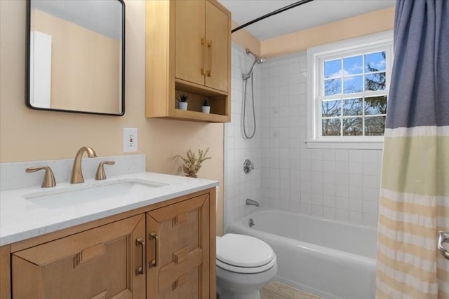 full bathroom with shower / tub combo, vanity, and toilet