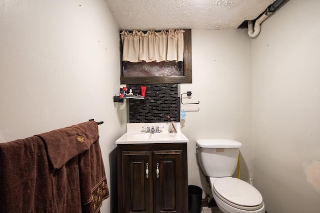 17 Lantern Rd, Revere, MA 02151 - bathroom with a textured ceiling, toilet, and vanity