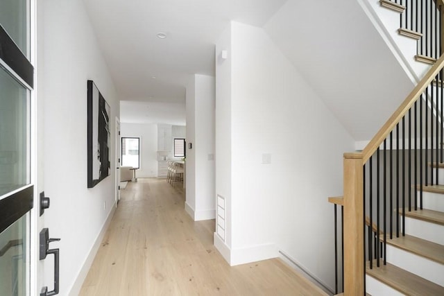 224 Auburn St Unit F, Newton, MA 02466 - hall with light wood finished floors and stairway