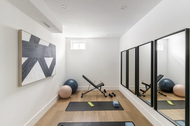 224 Auburn St Unit F, Newton, MA 02466 - exercise area featuring wood finished floors and baseboards