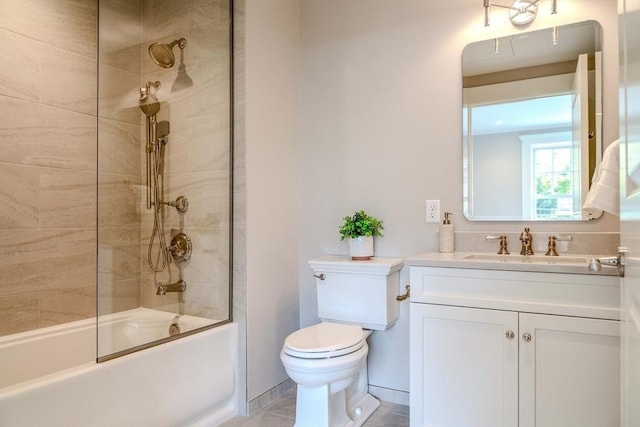 full bathroom with vanity, bath / shower combo with glass door, and toilet