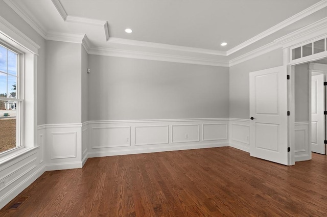 spare room with ornamental molding, dark wood-type flooring, wainscoting, and recessed lighting