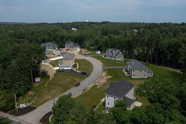 bird's eye view featuring a wooded view