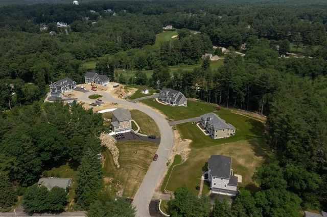 drone / aerial view featuring a forest view