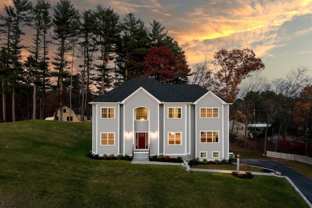 view of front of property with a lawn